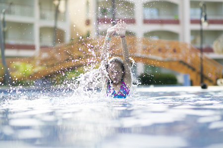 Portrait of Happy Girl in the Swimming Poolの写真素材