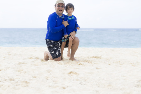 Lovely Father and Son Enjoying at the beach in Summerの写真素材
