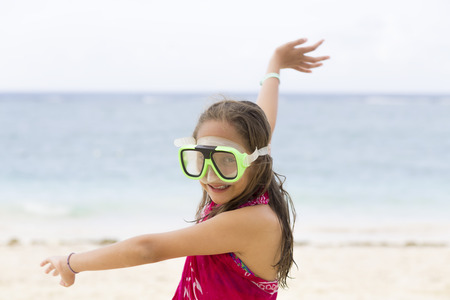 Happy Girl Playing at the beach in Summerの写真素材
