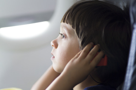 Happy Boy Listening to Music From the Web with Headphonesの写真素材