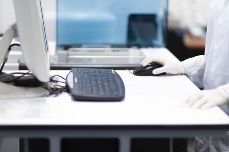 Female Nurse Working on Laptop Computer In Labの写真素材