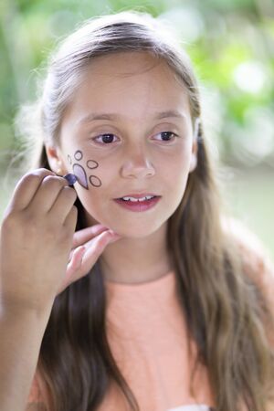 Beautiful Teen Getting her Face Painted, Makeup, Outdoorsの写真素材
