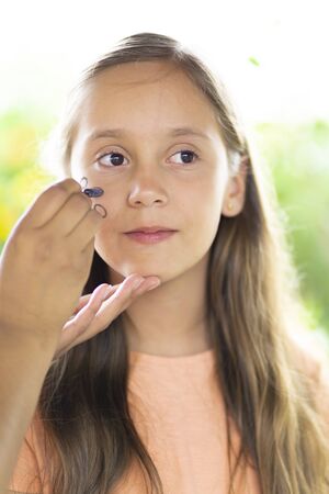 Beautiful Teen Getting her Face Painted, Makeup, Outdoorsの写真素材