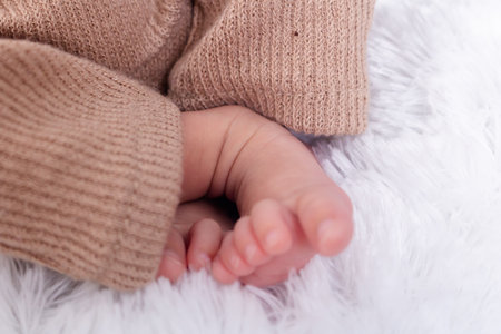 Foot of newborn baby. Close up of Hispanic newborn baby girl's feet. newborn baby.の写真素材