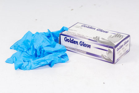 Blue gloves for health protection isolated on white background. Medical nitrile gloves. Manufacture of rubber gloves, latex gloves. protective glovesの写真素材