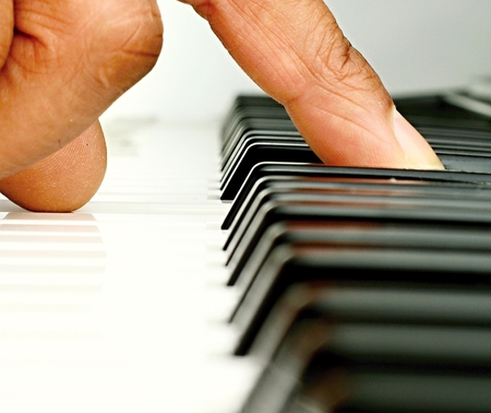 Image of a fantastic piano player playing a chord in a concert hall in Londonの写真素材