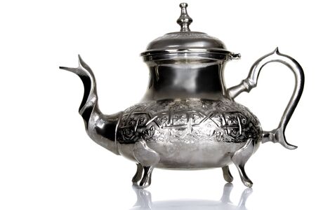 silver Moroccan teapot on table with white backgroundの写真素材
