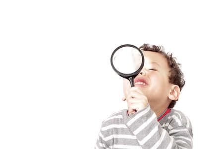 little boy with magnifying glass ready to explore stock photoの写真素材