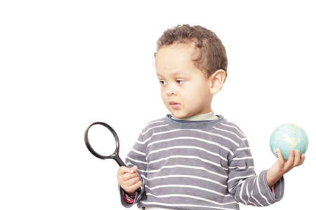 boy with magnifying glass ready to explore stock photoの写真素材