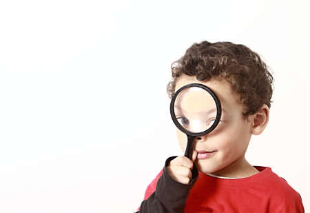 boy with magnifying glass ready to explore stock photoの写真素材