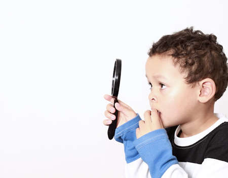 boy with magnifying glass ready to explore stock photoの写真素材