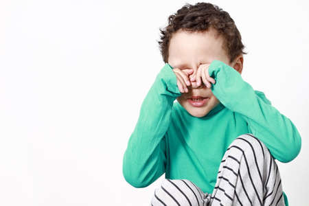 poor boy in poverty with no help alone and all by himself stock photoの写真素材