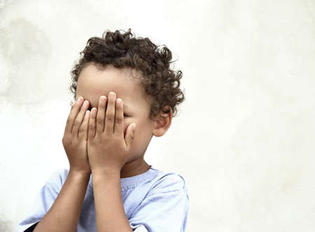 poor boy in poverty with no help alone and all by himself stock photoの写真素材