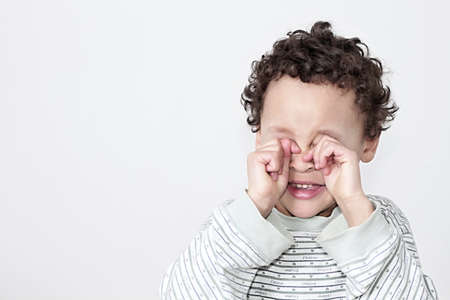 poor boy in poverty with no help alone and all by himself stock photo