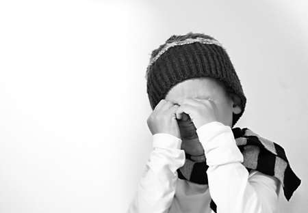 poor boy in poverty with no help alone and all by himself stock photo