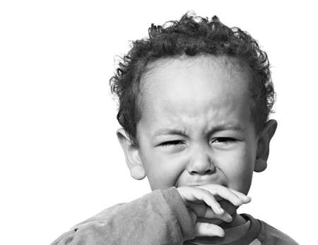 poor boy in poverty with no help alone and all by himself stock photo