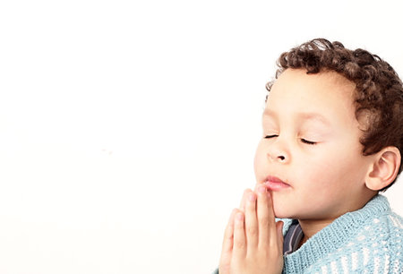 little boy praying to God with hands together pray in silence stock image stock photoの写真素材