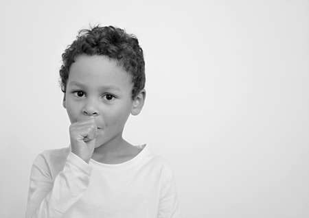 boy sucking thumb on white background stock photoの写真素材