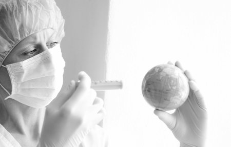 coronavirus vaccination with woman doctor and syringe with globe on grey background stock photoの写真素材