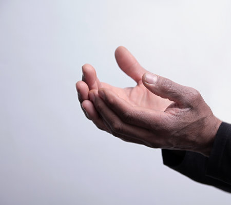 man praying to god with hands together on grey background stock image stock photoの写真素材