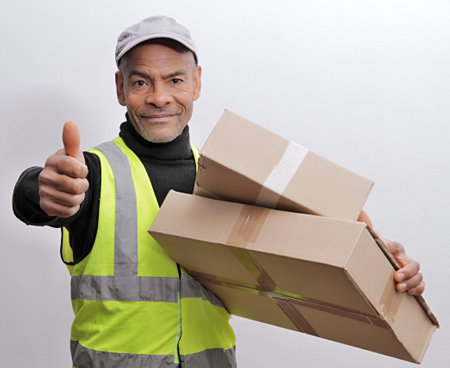 delivery man with parcel for a customer on white background stock photoの写真素材