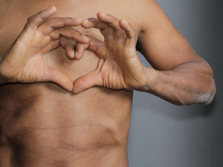 heart attack suffering from fatal heart attack on grey background stock photoの写真素材