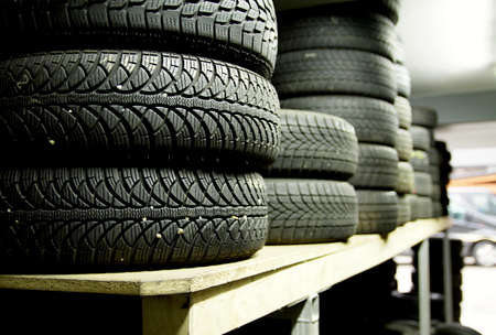 Car tires on a shelf in a car repair shop. High quality photo