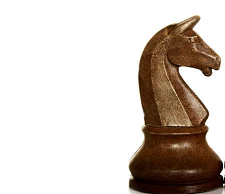 Wooden chess piece isolated on white background. Close-up.