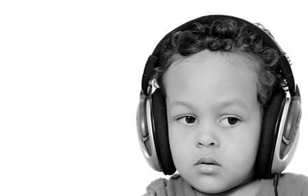 Portrait of young African-American boy listening to music with headphonesの写真素材