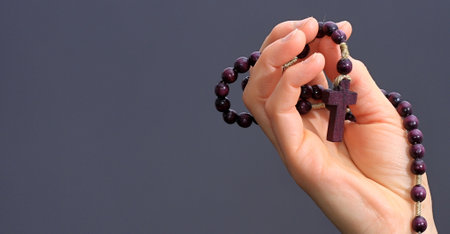 man praying to god with hands together Caribbean man praying with black background stock photos stock photoの写真素材
