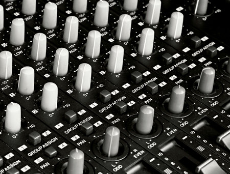 Audio mixing console close-up. Shallow depth of field.の写真素材