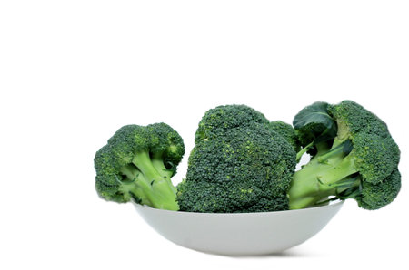 broccoli in a bowl isolated on white background with clipping path.の写真素材