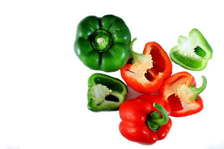 Red and green bell pepper isolated on white background with clipping path.の写真素材