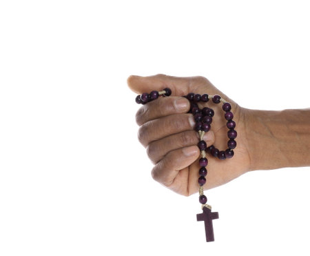 man praying to god with hands together Caribbean man praying with dark background stock photos stock photoの写真素材