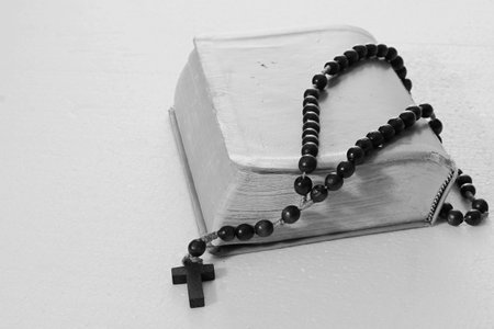 Bible and rosary on a white background. Black and whiteの写真素材