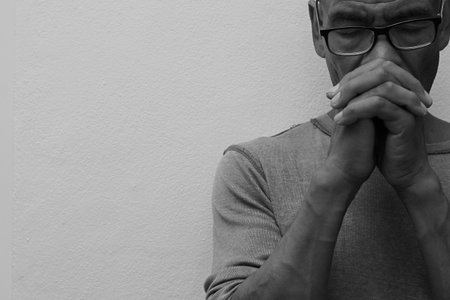praying to God  on black backgroundの写真素材