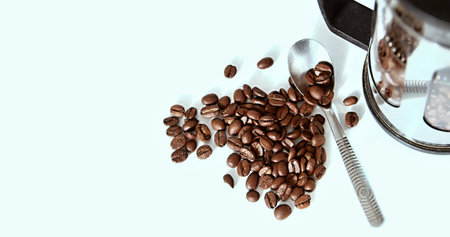 Coffee grinder and coffee beans on a white background.の写真素材