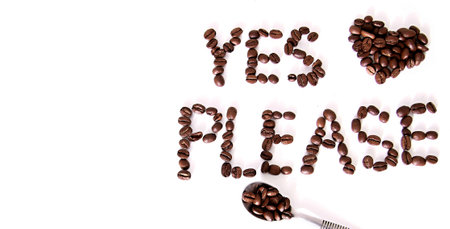 Coffee beans in the form of the words on a white backgroundの写真素材