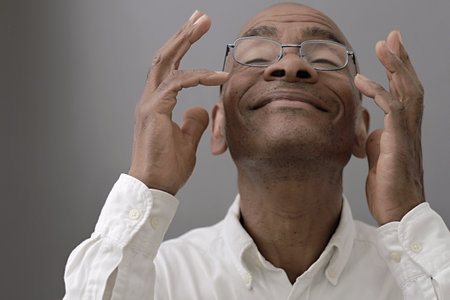 black man praying to god on gray background with people stock image stock photoの写真素材