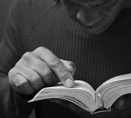 black man praying to god on gray background with people stock image stock photoの写真素材