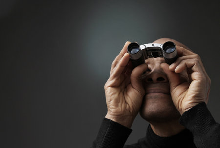 looking through binoculars with white background with people stock photo