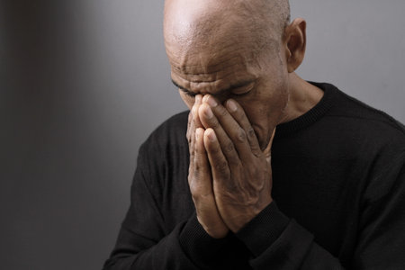 praying to god on gray black background with people stock image stock photoの写真素材