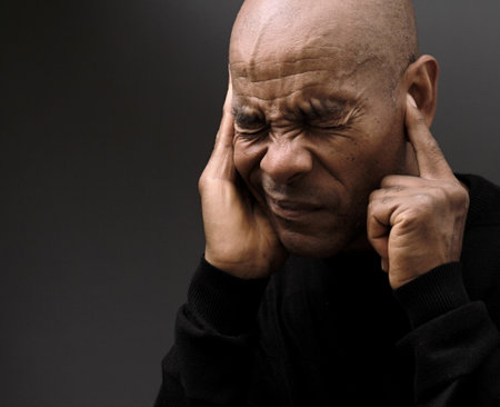deafness suffering from hearing loss on grey black background with people stock image stock photoの写真素材