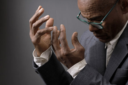 praying to god on gray black background with people stock image stock photoの写真素材