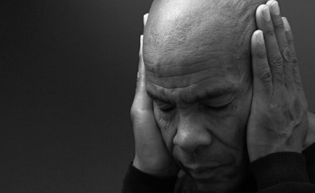 deafness suffering from hearing loss on grey black background with people stock image stock photoの写真素材