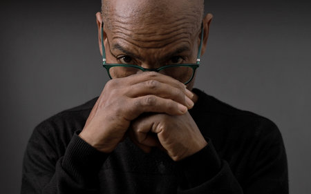 praying to god on gray black background with people stock image stock photoの写真素材