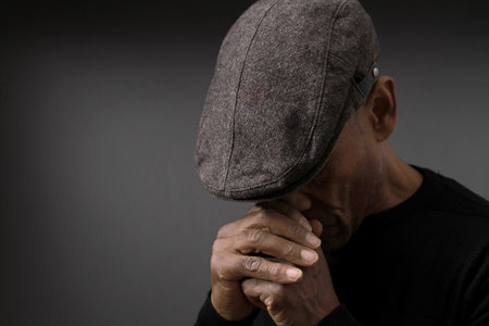 praying to god on gray black background with people stock image stock photoの写真素材