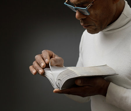 praying to god on gray black background with people stock image stock photoの写真素材