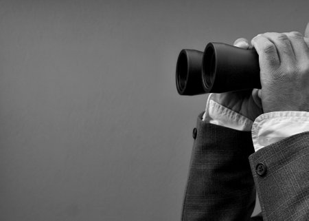 looking through binoculars with white background with people stock photoの写真素材