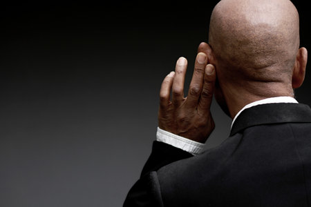 deafness suffering from hearing loss on grey black background with people stock image stock photoの写真素材